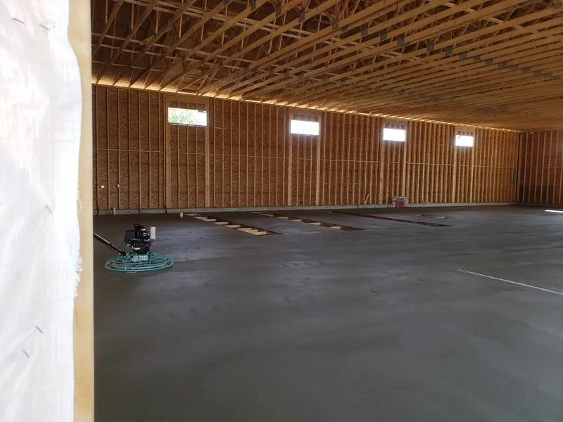 Power-troweled commercial concrete floor finished to a smooth, level surface