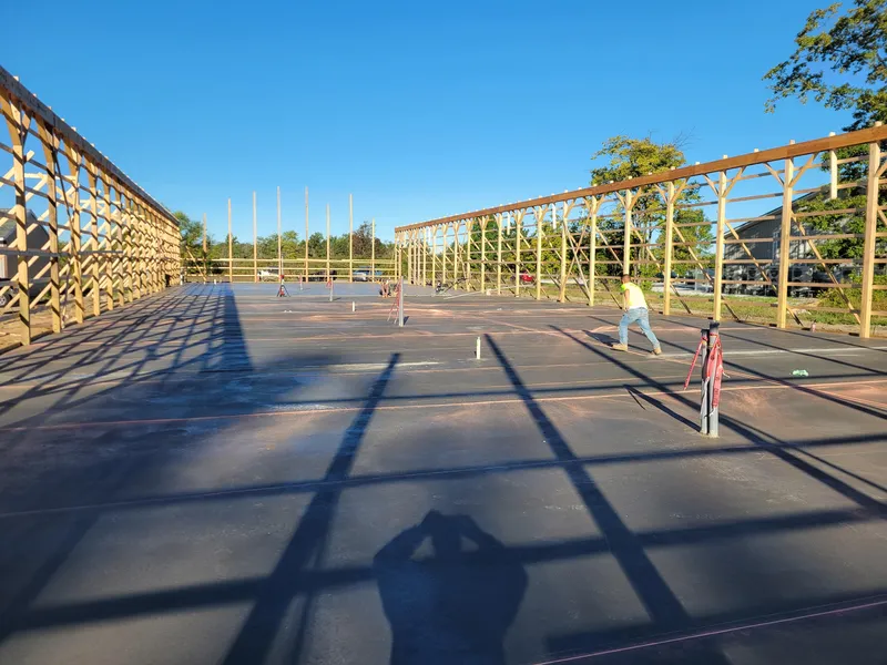 Concrete slab poured under a commercial pavilion structure