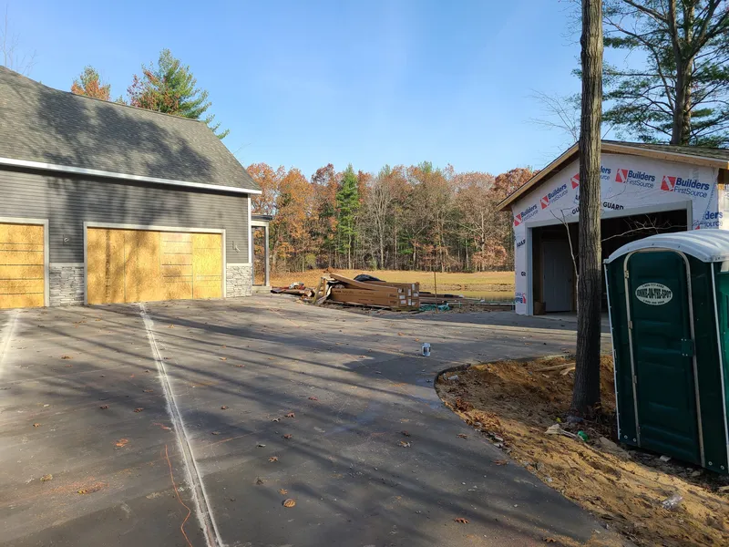 Concrete drive poured between two garage buildings