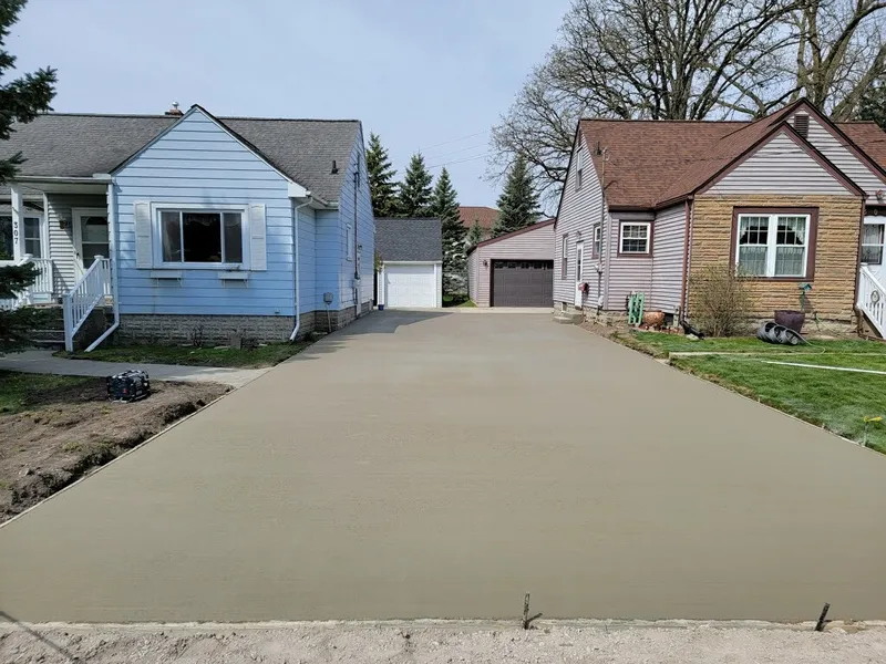 Concrete driveway poured between two neighboring homes
