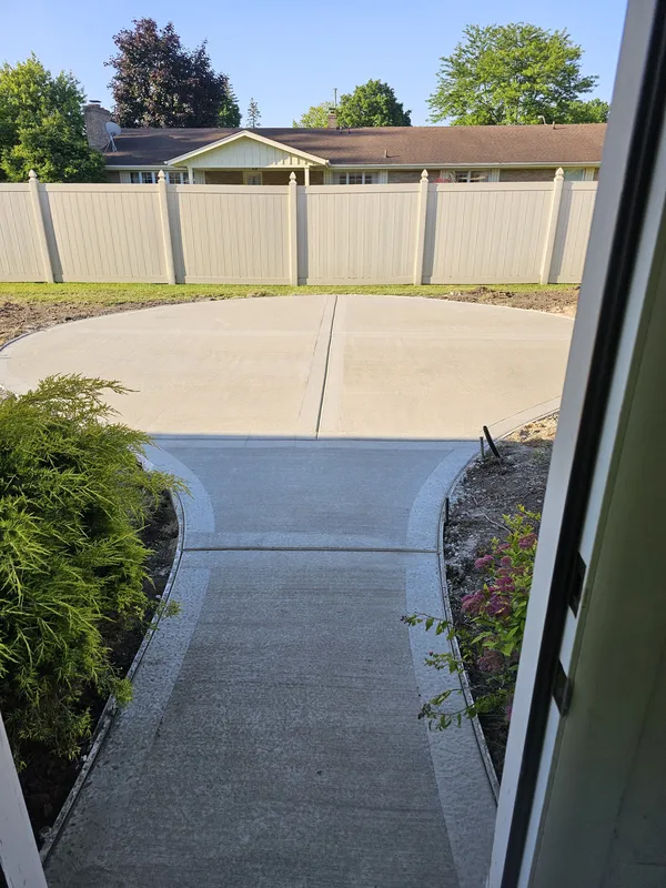Circular concrete driveway at a Mid-Michigan home