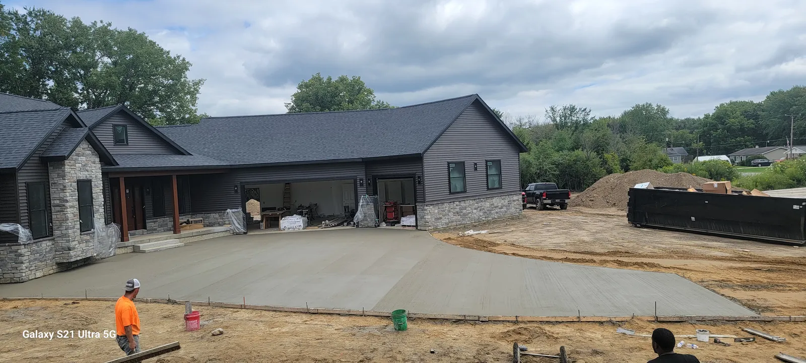 Concrete courtyard driveway at a modern ranch home in Mid-Michigan