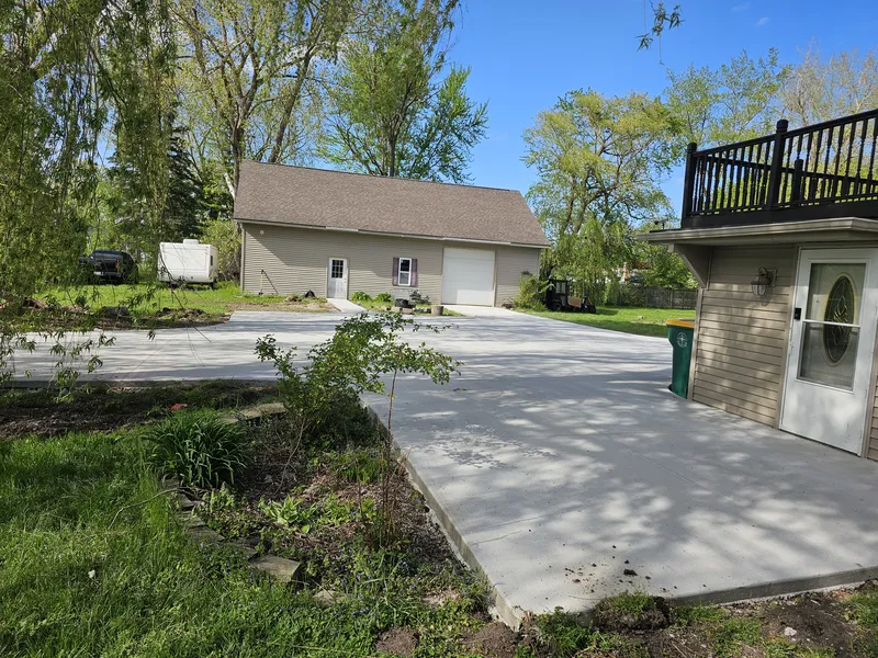 Concrete parking pad at a detached garage in Mid-Michigan