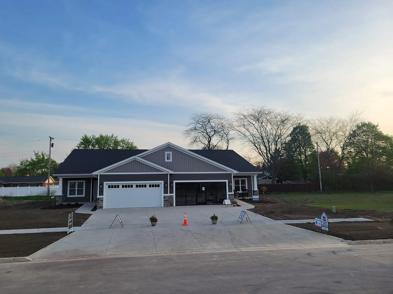 Concrete driveway at a ranch home photographed at dusk in Mid-Michigan