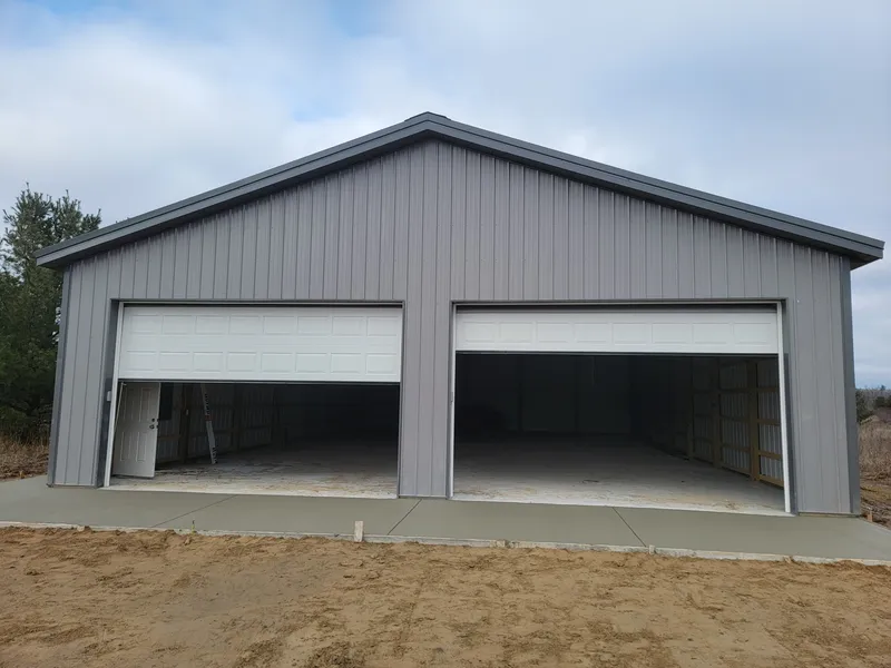 Concrete apron poured at a pole barn garage entrance