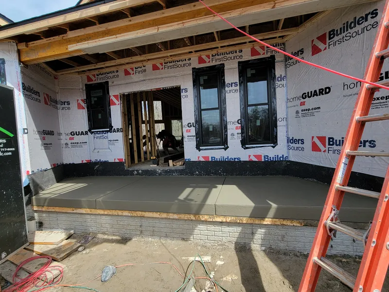 Poured concrete porch slab at a new-construction home