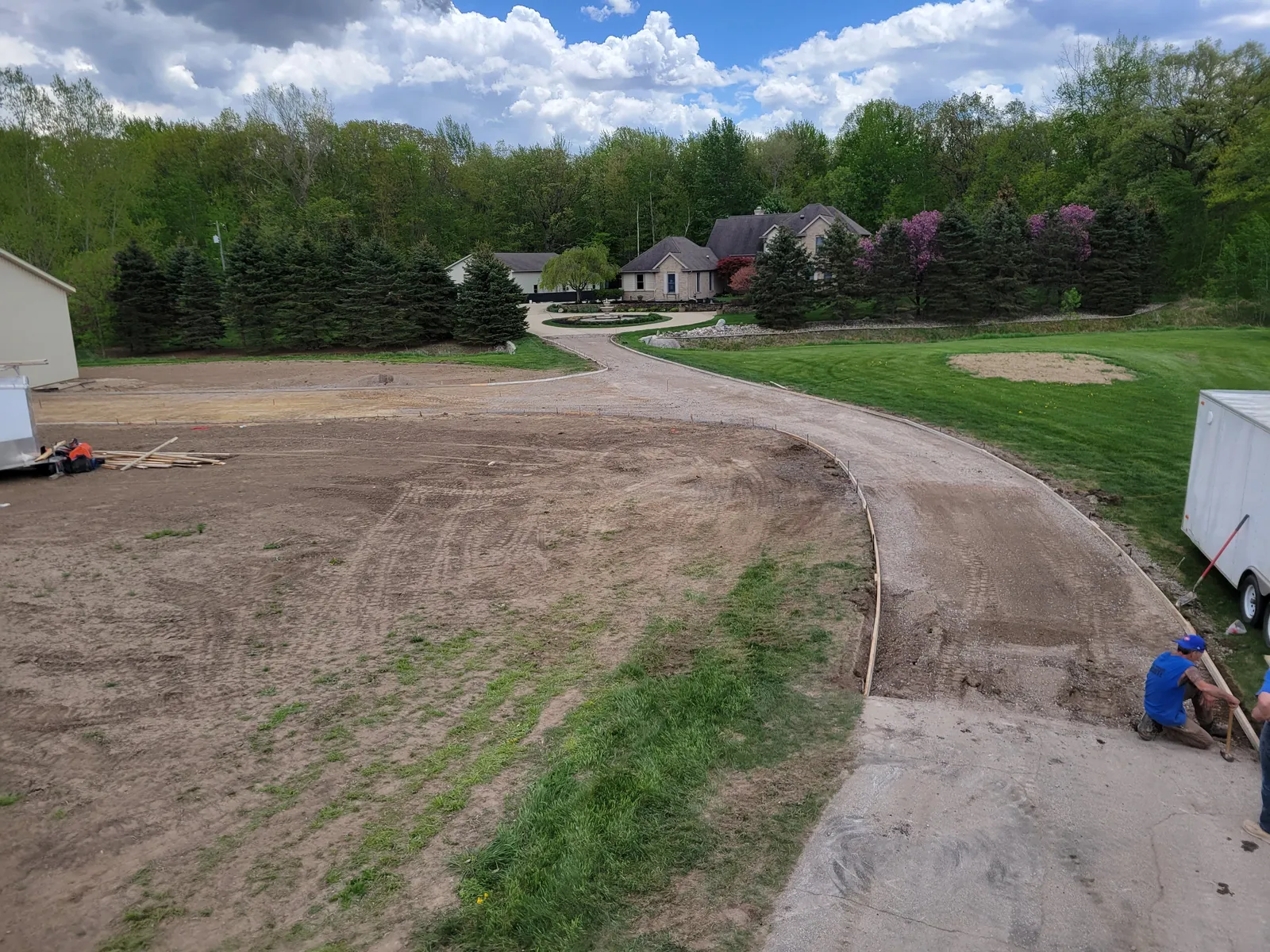 Graded and compacted base prepared for a large estate driveway pour