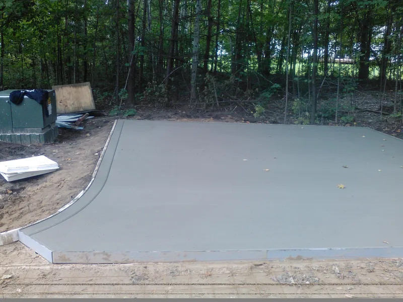 Concrete pad poured on a wooded Mid-Michigan property